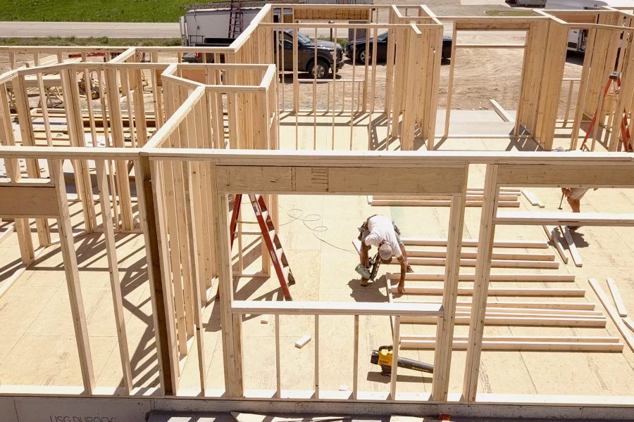 Drone View of a Home being Framed by Carpenters